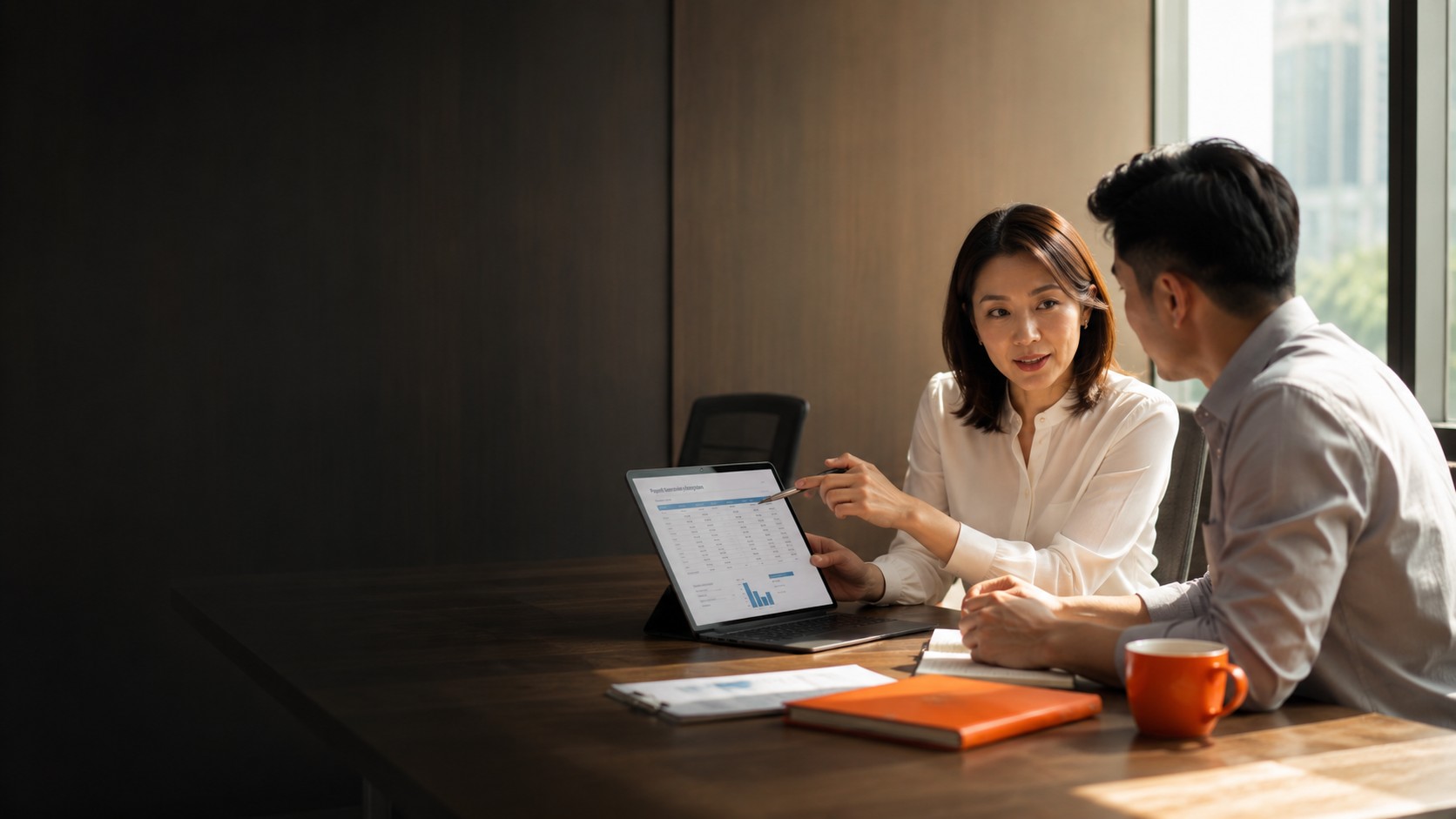 Payroll Outsourcing Indonesia — People Profilers payroll consultant reviewing monthly payslip report and statutory contributions with client